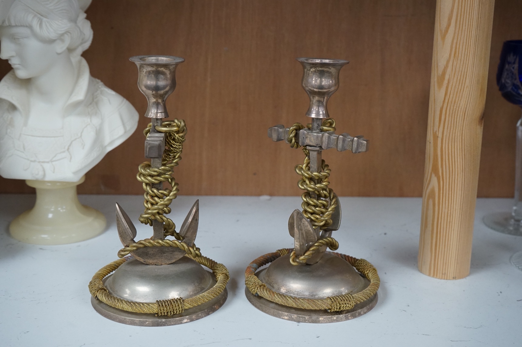 A pair of silver plated and part gilded anchor candlesticks, 18cm high.